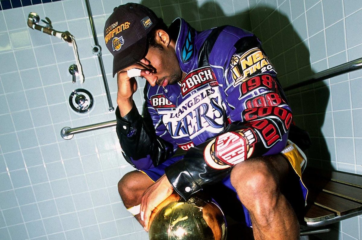 Kobe holding the 2001 NBA Championship trophy in tears.

